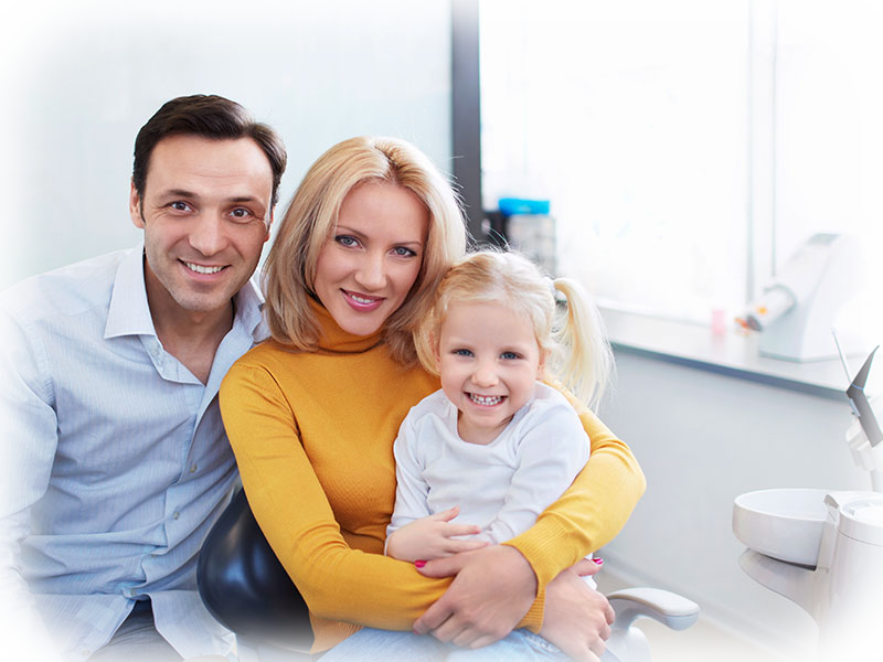 Family smiling during a visit to Cornwall Dental Arts