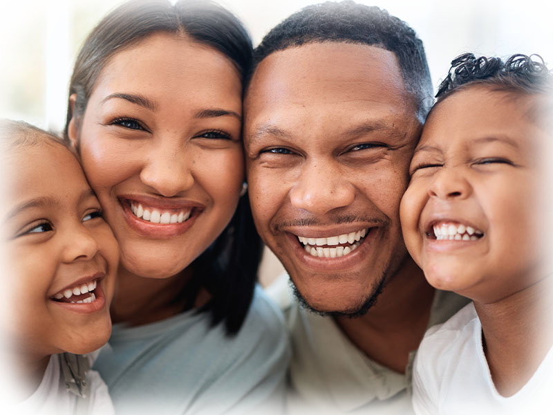 Family smiling together at home